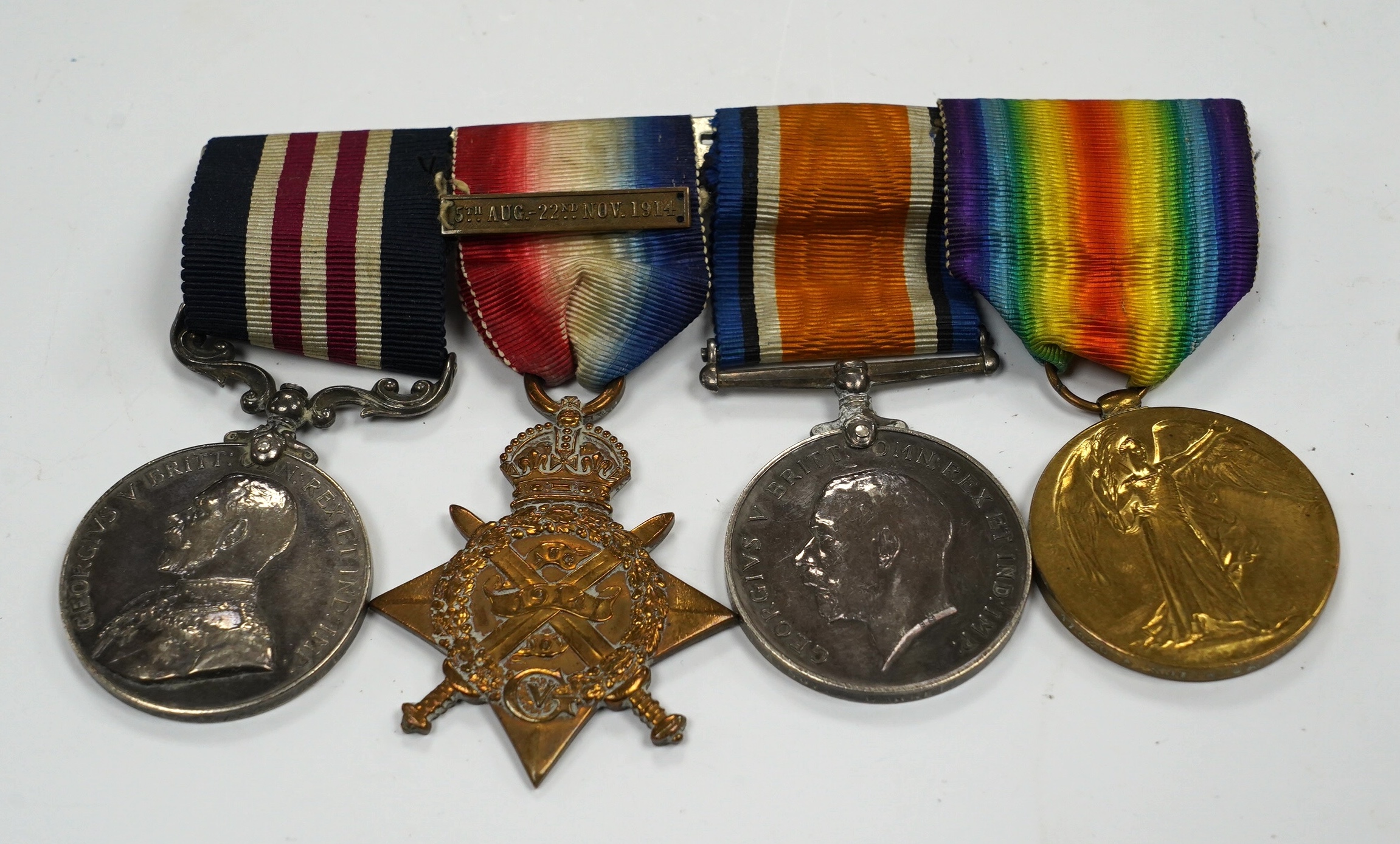 A First World War medal group awarded to Pte. W. Garnett R.A.M.C. comprising; a Military Medal for Bravery, a 1914 Star with a bar for 5th Aug. - 22nd Nov. 1914, a British War Medal and a Victory Medal, mounted together
